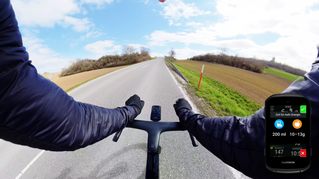 Fahrerperspektive auf eine Landstraße mit Fahrradlenker und Garmin Edge 850. Auf dem Display ist eine Energie- und Trinkempfehlung während der Fahrt zu sehen.